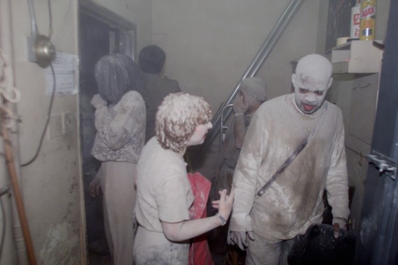 People seek refuge inside a bank building after the first to