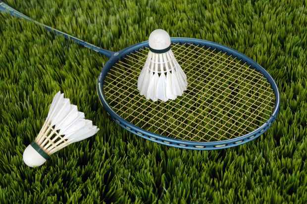blue badminton racket with shuttlecock