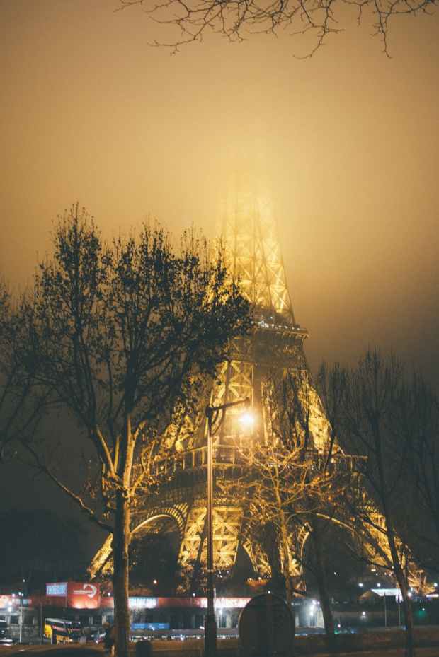 photo of eiffel tower during foggy night