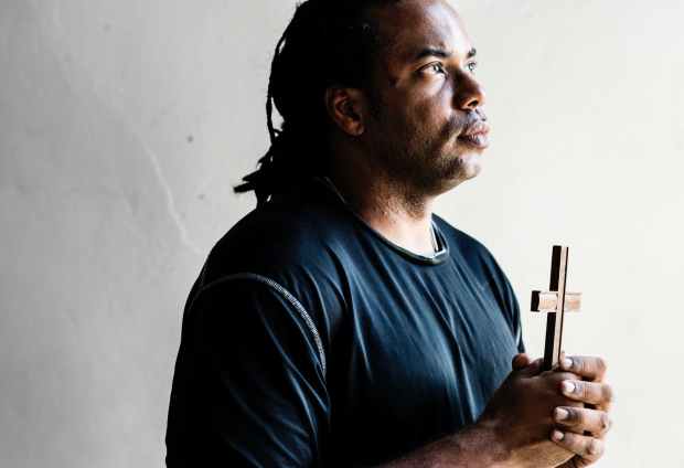 man holding cross