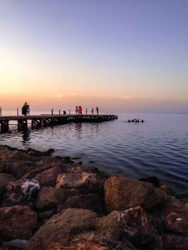 people walking on wooden dock