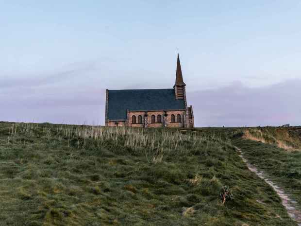 brown and blue house on mountain