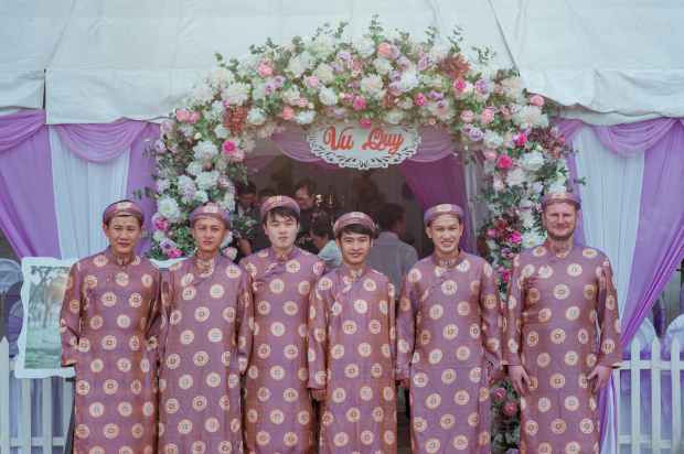 group of men wearing pink robes